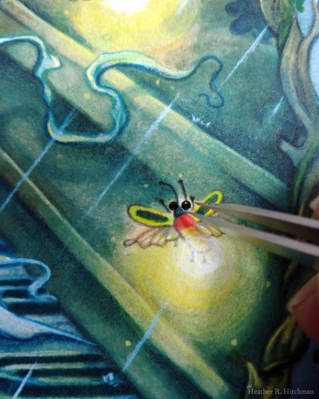 Close up photograph of a watercolor and gouache painting print of “Blue Hair and the Piano” by Heather R. Hitchman. The painting has a moody and rainy atmosphere. The photograph focuses on the firefly hovering over the piano keys by the faun’s blue hand. Tweezers are adhering small sparkling black flat back crystals to the print in place of the fireflies eyes.