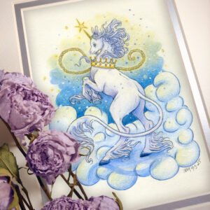 Photograph of a matted print of a colored pencil and graphite drawing of a purplish white yule unicorn rearing up on a large white cloud. The unicorn is standing with it’s back to the viewer while rearing up on it’s hind legs. The unicorn’s face has a peaceful expression, and is looking over the shoulder in profile view facing to the left. The unicorn’s front legs are tucked in to his chest, the golden horn on its forehead pointing towards a large yellow star floating in the air. The unicorn has long flowing white and violet colored hair, and fluffy tendrils of fur coming from the hooves and chin. They are wearing a golden crown around their neck. The crown has a long chain attached to it that is floating in the air around the unicorn. The unicorn has a long white lion’s tail that floats behind his rear legs. In the background is a cloudy shape of a blue and yellow gradient night sky filled with stars and snowflakes. The mat-board is white on the top layer and silver on the second layer. Purple roses rest on top of the print to the left. A small silver stamp with the Terratoff icon is at the bottom left corner of the print, under the roses.
