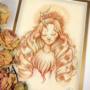 Photograph of a matted print of a graphite and colored pencil portrait drawing of a female faun with flowing orangey pink hair, closed eyes, and one twisted antler growing from the center of her forehead. The faun is depicted waist up, facing forward. She has a serene expression on her face and a gentle smile. Her hair is set into several giant ringlets that tumble down over her shoulders to her waist. A turf of wavy fur grows at the base of her neck and covers her bare chest. Pink roses are scattered throughout her hair, and she wears a bouquet of more roses at the top of her head like a crown. Behind her a radiant orange sun illuminates around the back of her head like a halo. The mat-board is white on the top layer and gold on the second layer. Yellow roses rest on top of the print to the left. A small gold stamp with the Terratoff icon is at the bottom right corner of the print.