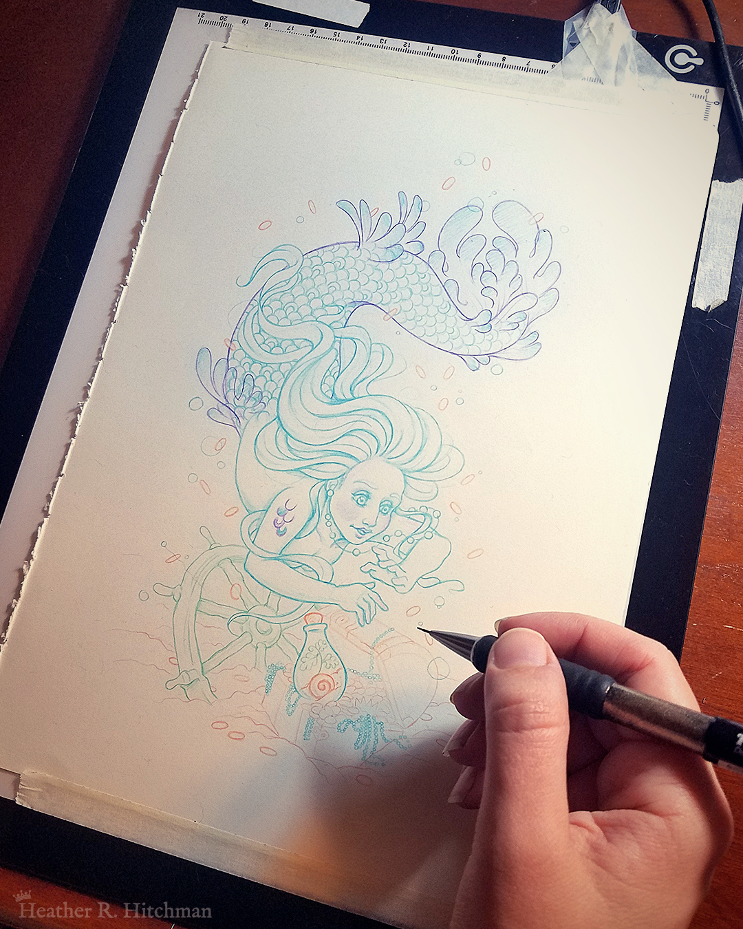 Blue Mermaid swimming underwater in the sea searching for a treasure chest