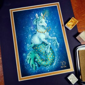 Photograph of a matted print of a full body watercolor, gouache, and colored pencil painting of a mermaid unicorn under the sea. Also known as a mermacorn, the creature has a white unicorn torso and a green mermaid tail. The mermacorn appears to be a young colt, with large light green eyes, a short glowing golden horn, and long spindly front legs. The unicorn wears a necklace of golden pearls and floats effortlessly in the dark waters with a smile on its face. They are facing ¾ to the right, and appear to be glowing so that the dark waters immediately around them are illuminated to a lighter blue color. The mermacorn has golden scales scattered among the length of its green tail. The background is a gradient of blue water, with white bubbles surrounding the floating mermacorn from head to tail. The mat-board is black on the top layer and gold on the second layer. Small pans of gold and silver watercolor pigment and a golden ink pad surround the print.