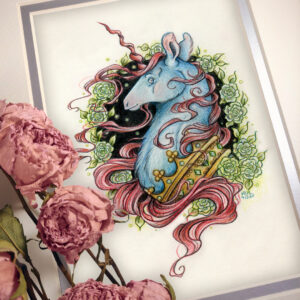 Photograph of a matted print of a graphite and colored pencil portrait drawing of a blue and red dark unicorn bust framed in a circular wreath of soft green gardenia flowers. The background inside of the wreath behind the unicorn is sepia with tiny orbs of green light floating around. Outside of the wreath the portrait has a sepia background color. The unicorn lifts his head proudly in profile facing to the left. He has a flowing red mane and chin beard, blue fur, and a long red corkscrew horn in the center of his forehead. The dark unicorn wears a large crown of emerald and ruby jewels around his neck. The mat-board is white on the top layer and silver on the second layer. Pink roses rest on top of the print to the left. A small silver stamp with the Terratoff icon is at the bottom left corner of the print, under the roses.