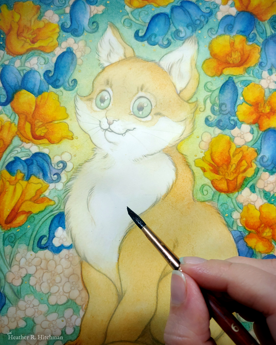 Close up photograph of a watercolor, gouache, and colored pencil portrait painting of an orange cat sitting in a garden. The painting is currently being painted by the artist, who’s hand is in the bottom right of the photograph holding a paintbrush. So far the painting is composed of loose line art and washes of watercolor. The photograph focuses on the cat’s face. The cat sits upright at a ¾ angle on the grass, facing to the left with a wide eyed happy expression on his face. His fur is tinted with a light wash of golden orange. An archway of bluebells, yellow California poppies, and small white flowers surround the cat in an enchanted garden scene. The background is dark teal green with a sunburst of yellow light coming from behind the cat.