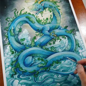 Photograph of a watercolor, gouache, and colored pencil painting print of a gigantic water dragon sitting atop a sea of foaming waves out in the ocean. The sky behind the dragon is moody, almost completely covered with dark gray storm clouds. A burst of white and yellow sunlight breaks through the storm clouds behind the dragon’s head. The dragon has a long snakelike body covered in blue scales. Green frills of fins run down the length of the dragon’s back, and several more fins appear along its sides. The dragon has no wings, instead presenting like a classic eastern style dragon with long white whiskers, golden horns, front legs at the chest, and stumpy back legs towards the end of his long tail. The dragon’s body coils in a ribbon like shape, with its head upright and facing to the left. In it’s claws the dragon clutches a mer-bull that struggles to escape. The dragon’s face is menacing and mystical, with a hungry wicked smile showcasing his fangs and a giant pink tongue. The print has a 1/4inch white border, and the hand of the artist is holding a paintbrush in the bottom right corner of the print as she adds small silver orbs with metallic paint.